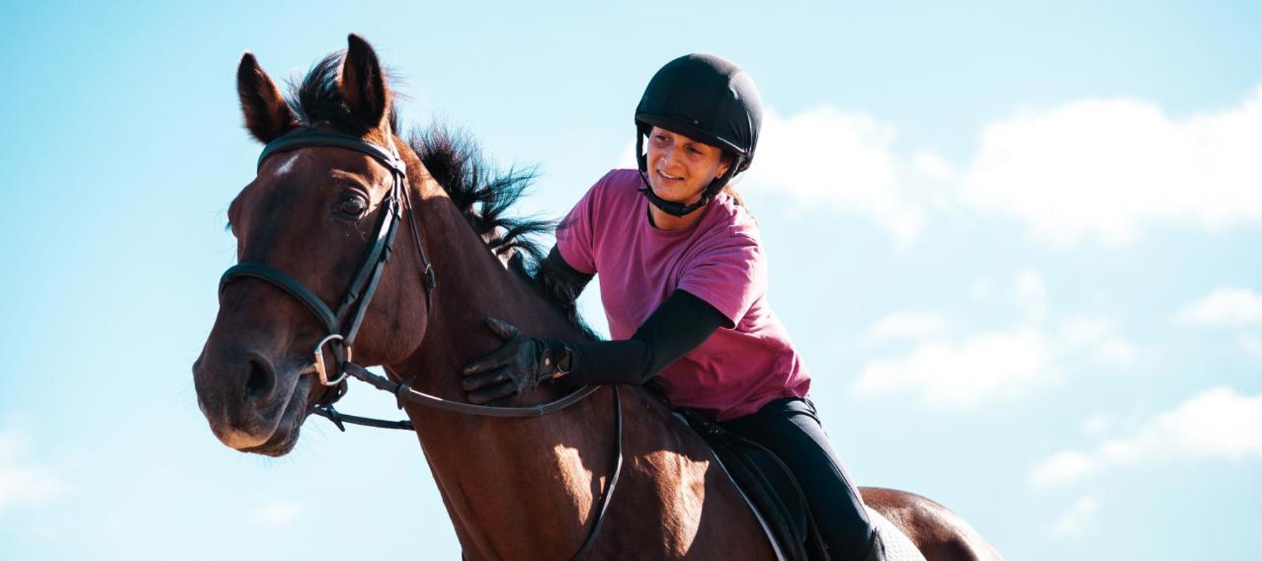 Rider Stroking Horse Smiling