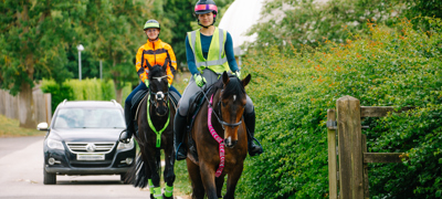 Horses And Riders In Hi Vis Hacking On The Road (2)